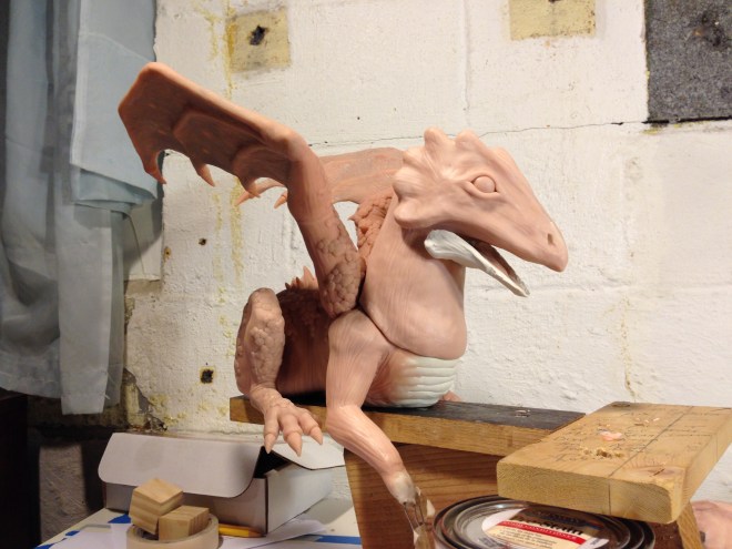 working on sculpting the dragon's head
