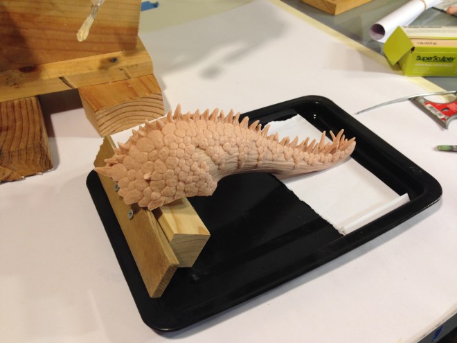 dragon tail ready to be baked on tray with custom stand