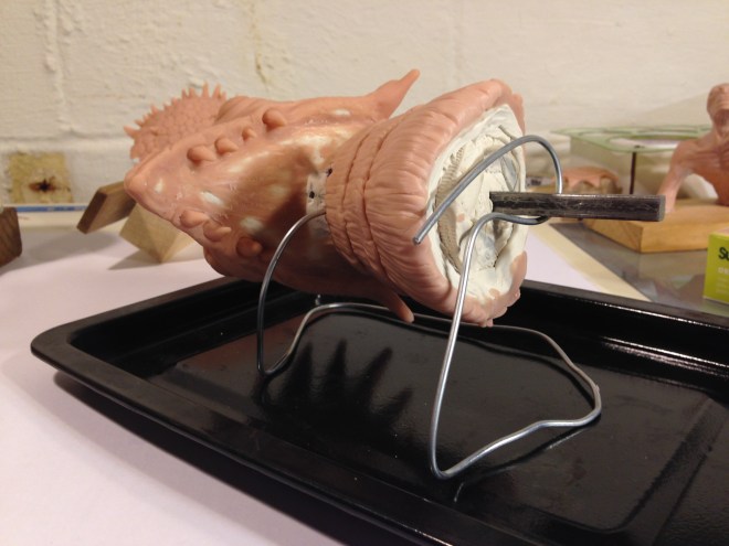 dragon head sculpey ready to be baked on custom wire stand